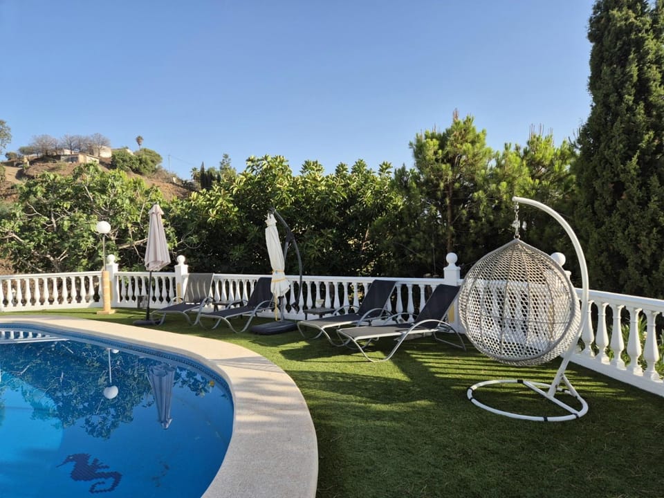 Property building, Living room, Swimming pool