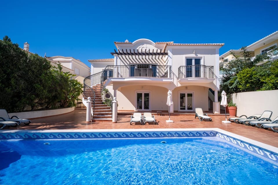 Property building, Patio, Pool view, Swimming pool, sunbed