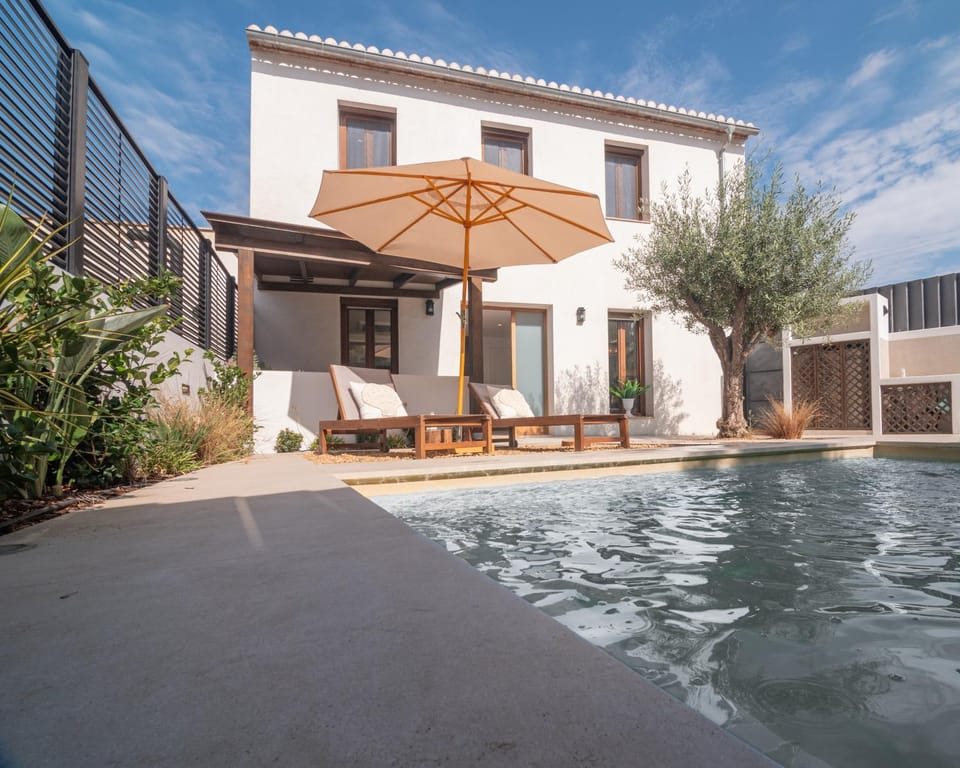 Property building, Patio, Pool view, Swimming pool, sunbed