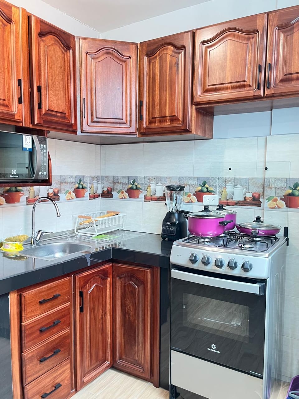 Kitchen or kitchenette, dishwasher, microwave, oven