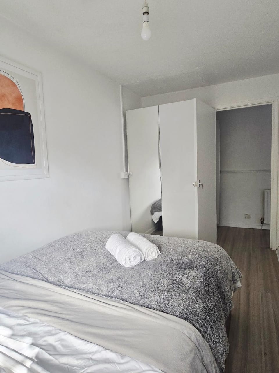 Bed, towels, wardrobe