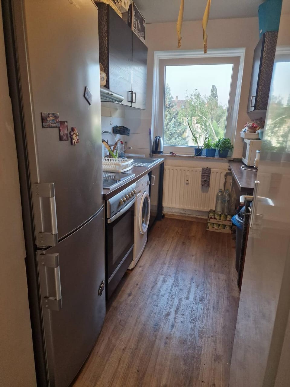 Kitchen or kitchenette, dishwasher, oven, stove