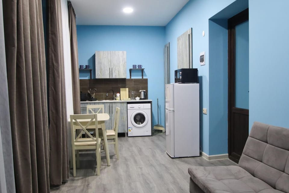 Kitchen or kitchenette, Seating area, Dining area, microwave, washing machine