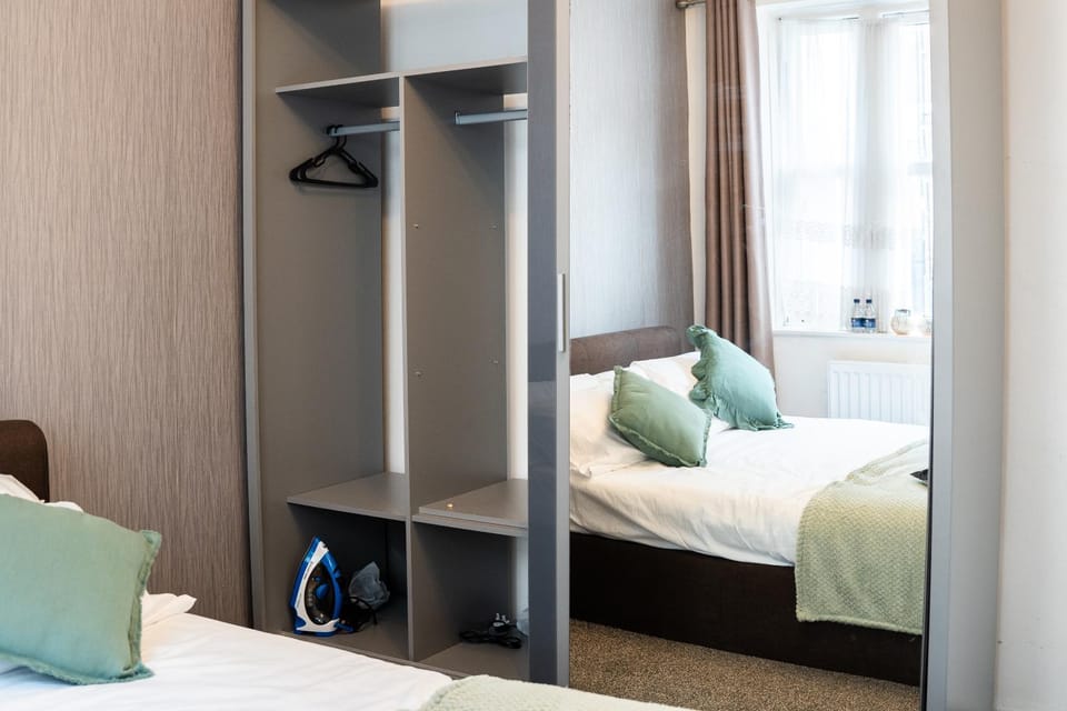 Bed, Bedroom, flat iron, hair dryier, wardrobe