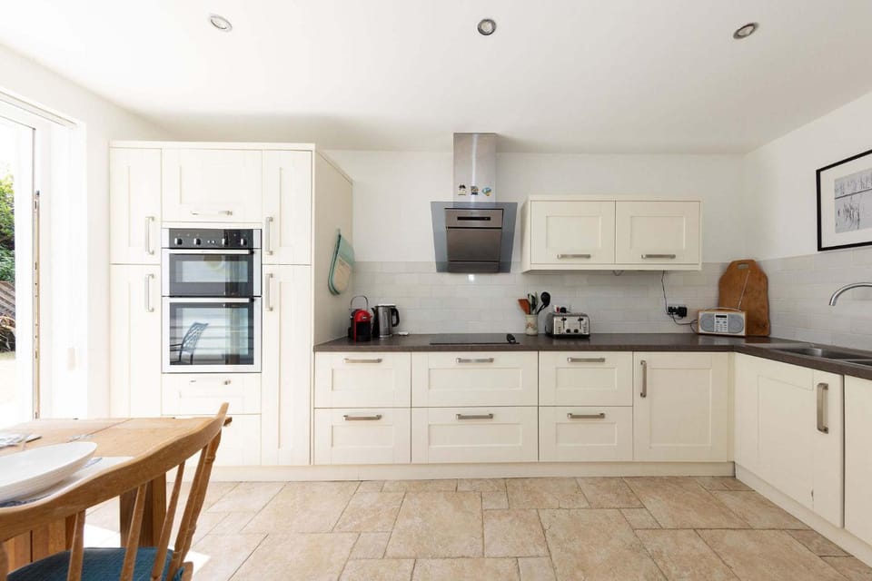 Kitchen or kitchenette, dishwasher, oven, stove, toaster