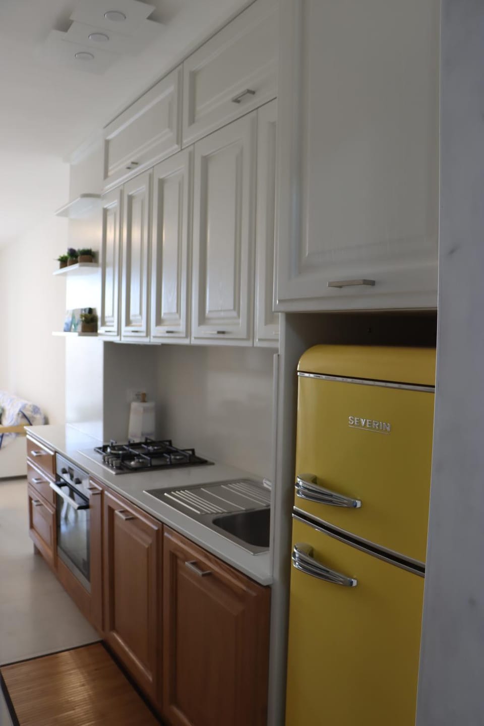Kitchen or kitchenette, dishwasher, oven, stove