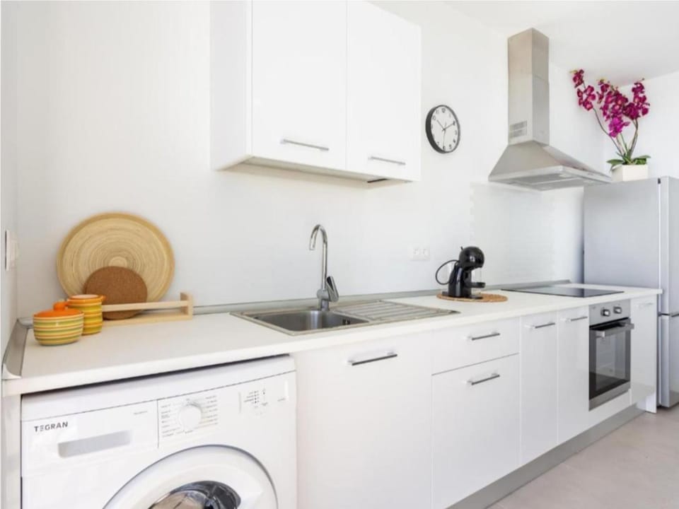 Kitchen or kitchenette, oven, stove, washing machine