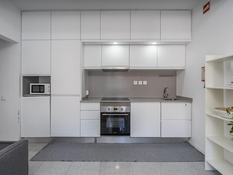Kitchen or kitchenette, dishwasher, oven, stove, toaster