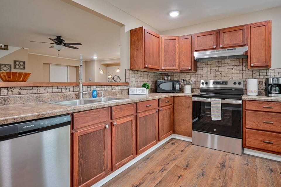 Kitchen or kitchenette, dishwasher, oven, stove