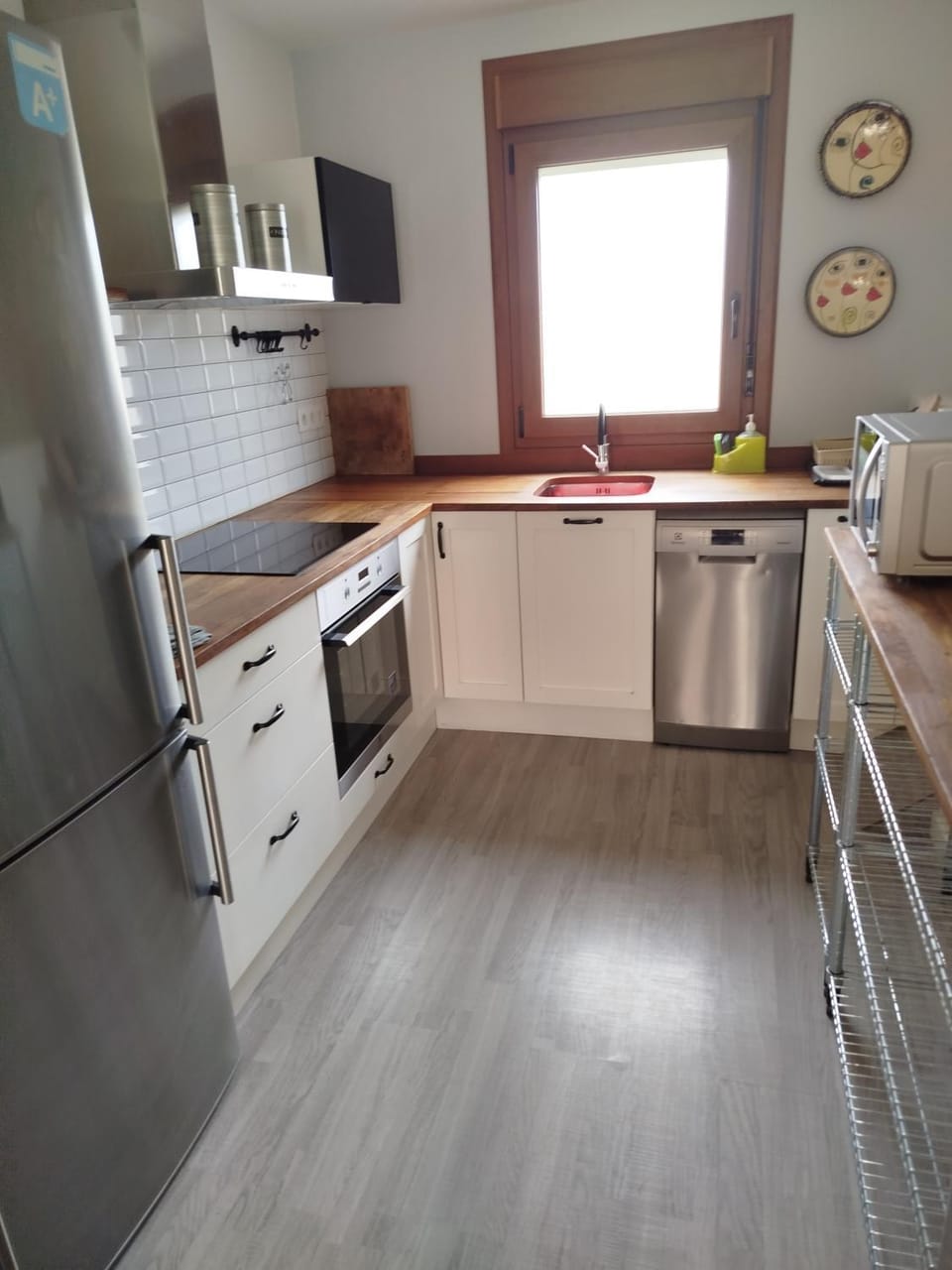 Kitchen or kitchenette, dishwasher, oven, stove