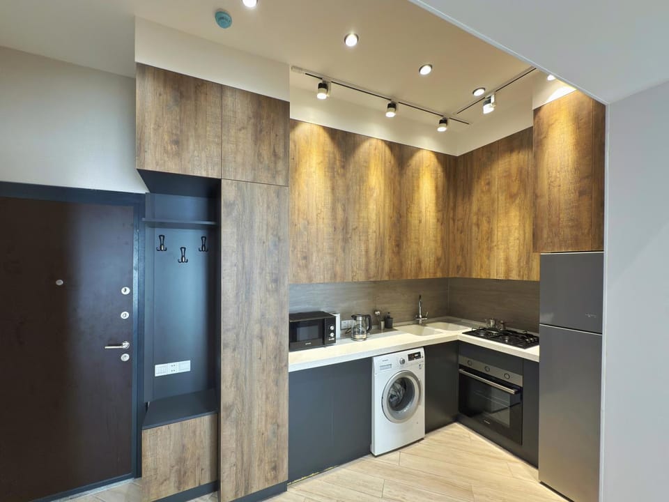 Kitchen or kitchenette, oven, stove, washing machine