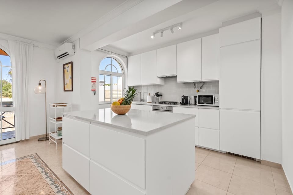 Kitchen or kitchenette, dishwasher, stove, toaster