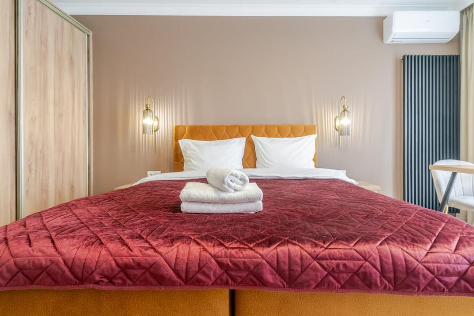Bed, towels, wardrobe