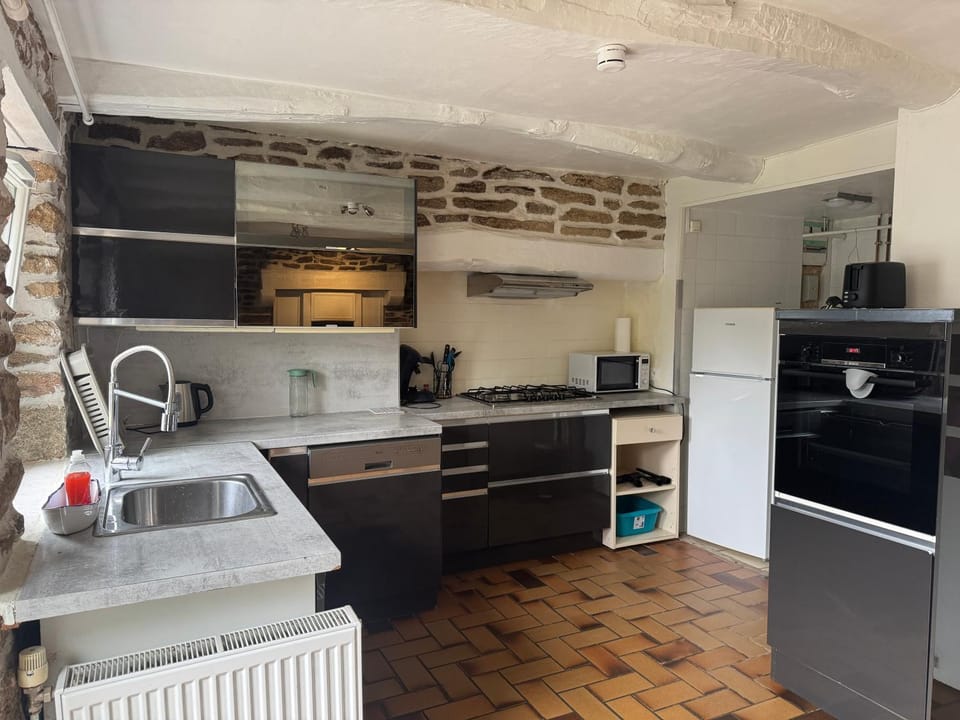 Kitchen or kitchenette, dishwasher, oven, stove, toaster