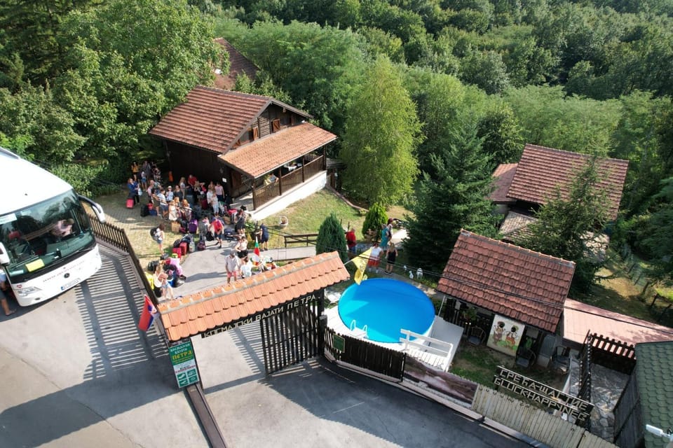 Property building, Natural landscape, Bird's eye view, Swimming pool, group of guests