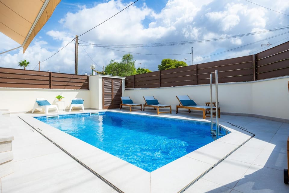 Property building, Living room, Swimming pool