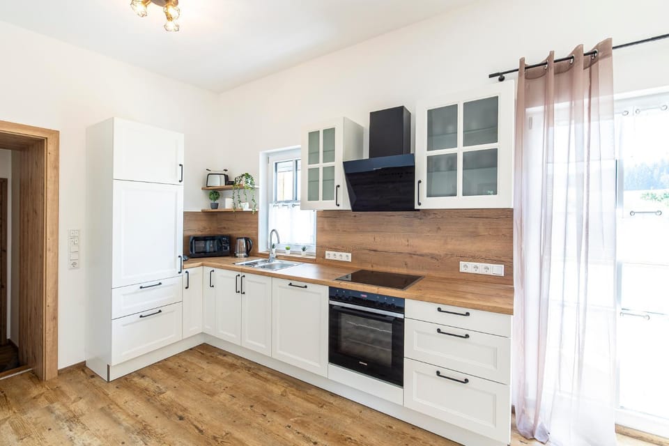 Kitchen or kitchenette, dishwasher, oven, stove