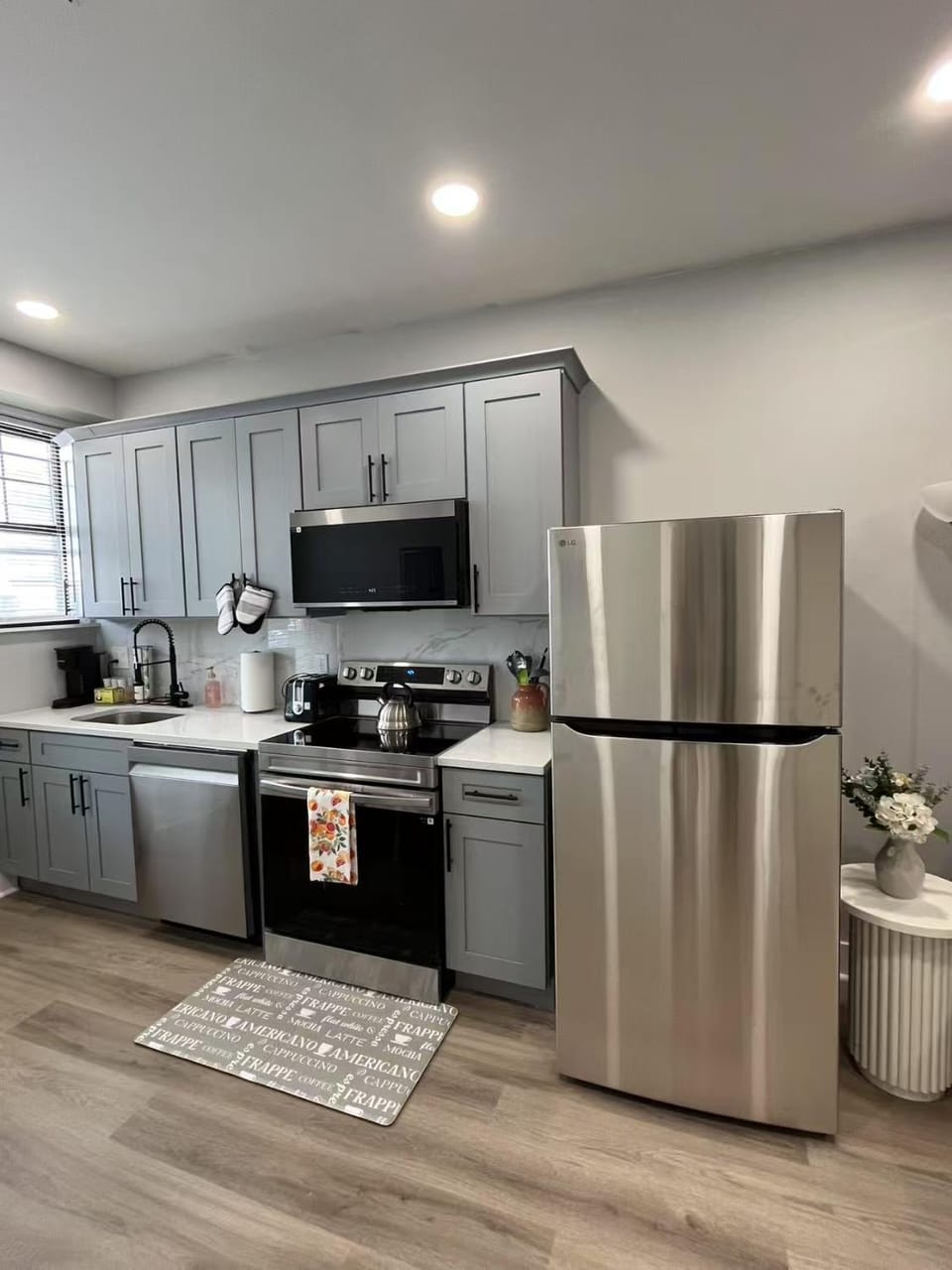 Kitchen or kitchenette, dishwasher, oven, stove