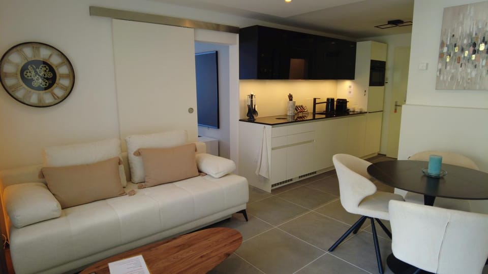 Living room, Dining area, dishwasher, microwave, stove, washing machine, kitchen