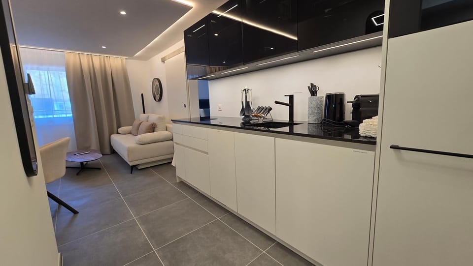 Kitchen or kitchenette, stove, washing machine, kitchen