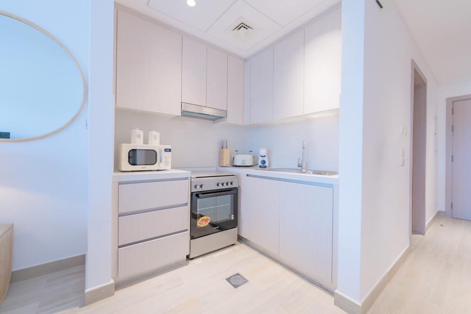 Kitchen or kitchenette, microwave, oven, stove, toaster