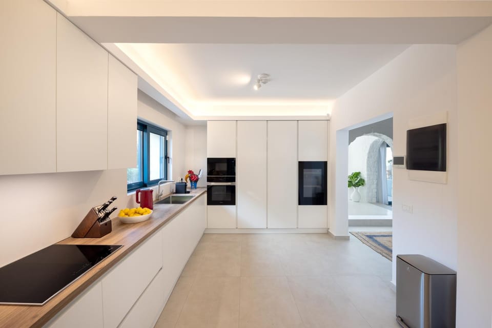 Kitchen or kitchenette, dishwasher, oven, stove