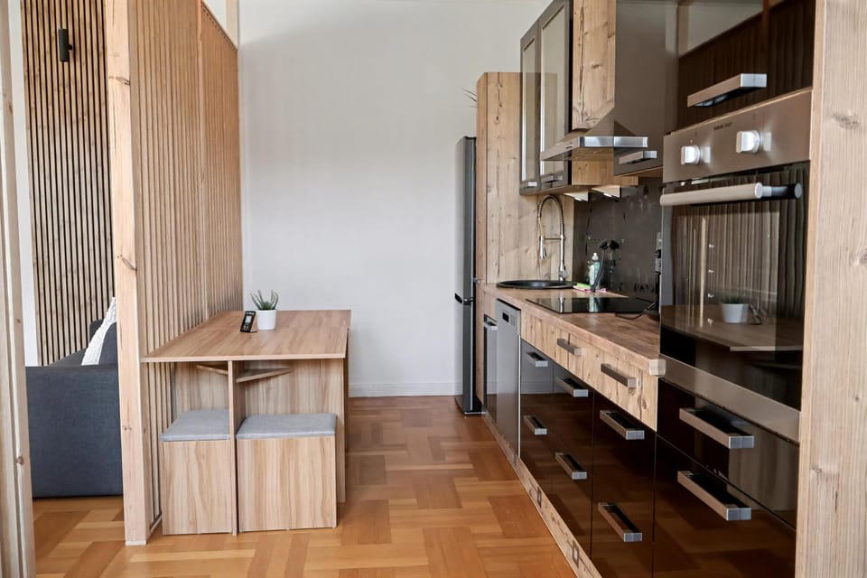 Property building, Kitchen or kitchenette, Living room, Dining area, minibar, oven, stove, toaster, toaster, wardrobe