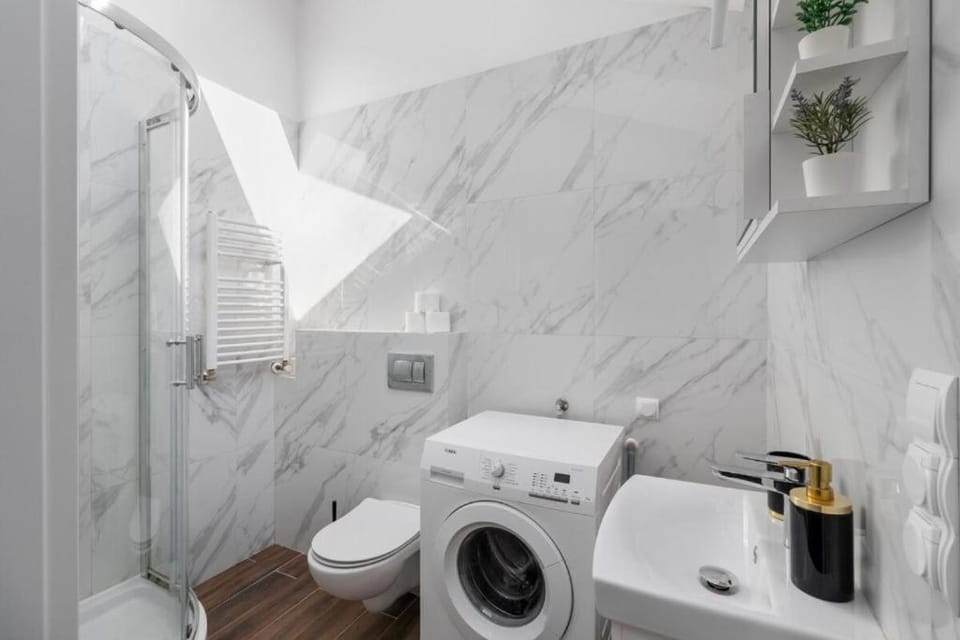 Shower, Toilet, Bathroom, towels, washing machine, dryer