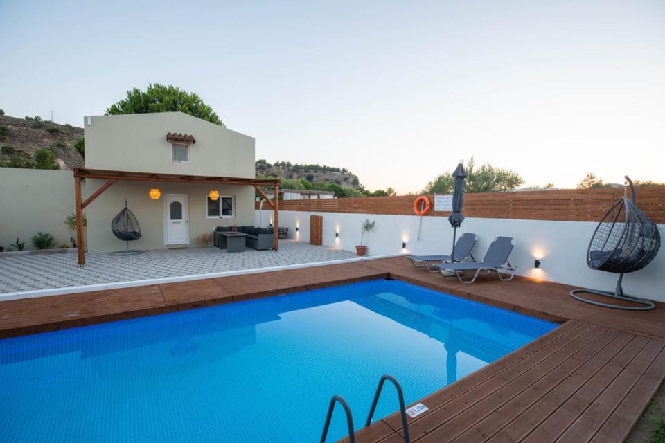 Property building, Patio, Pool view, Swimming pool, sunbed