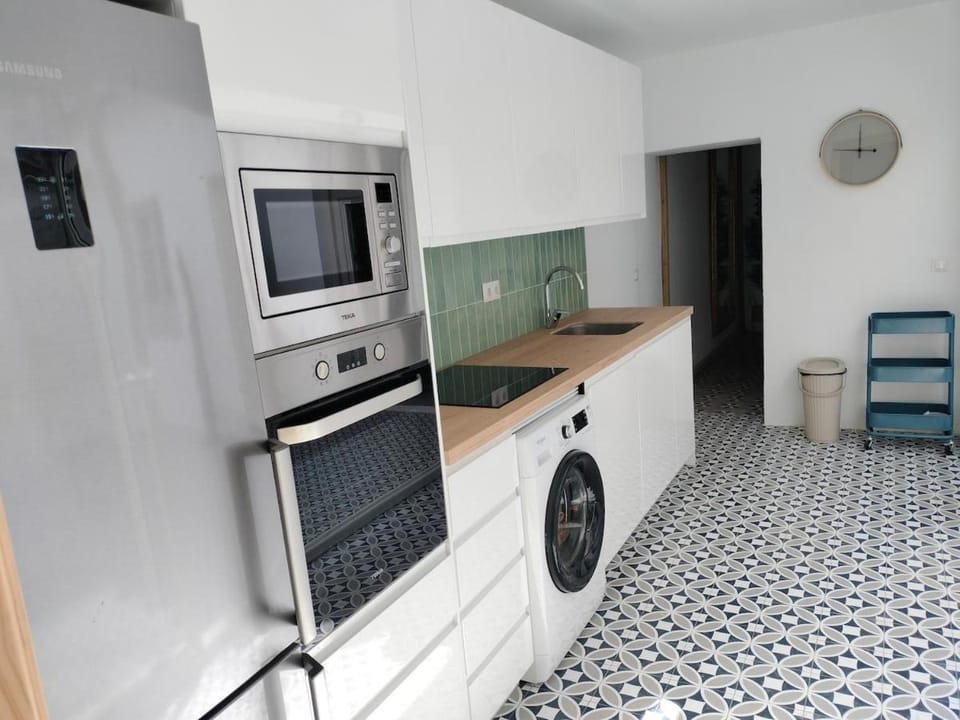 Kitchen or kitchenette, dishwasher, oven, stove, washing machine