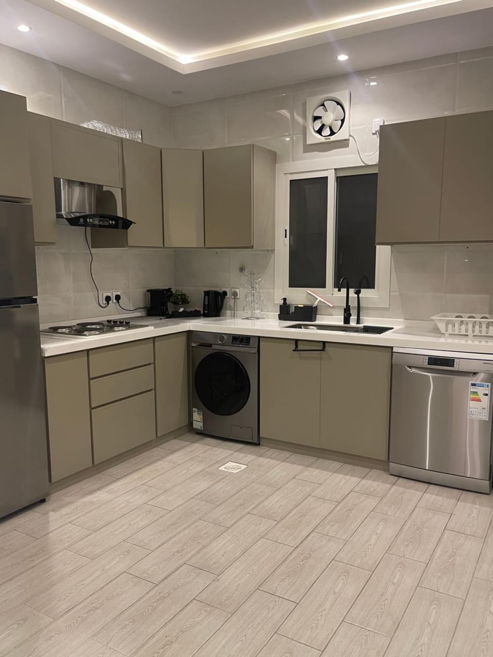 Kitchen or kitchenette, dishwasher, oven, stove, washing machine