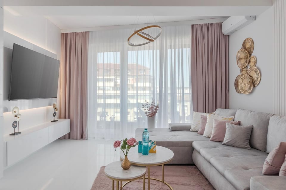 Bed, TV and multimedia, Living room, Seating area, air conditioner