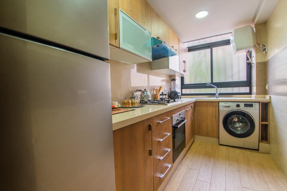 Kitchen or kitchenette, oven, washing machine, dryer