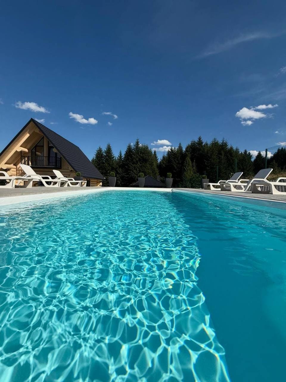 Property building, Nearby landmark, Day, Natural landscape, Mountain view, Pool view, Swimming pool, sunbed