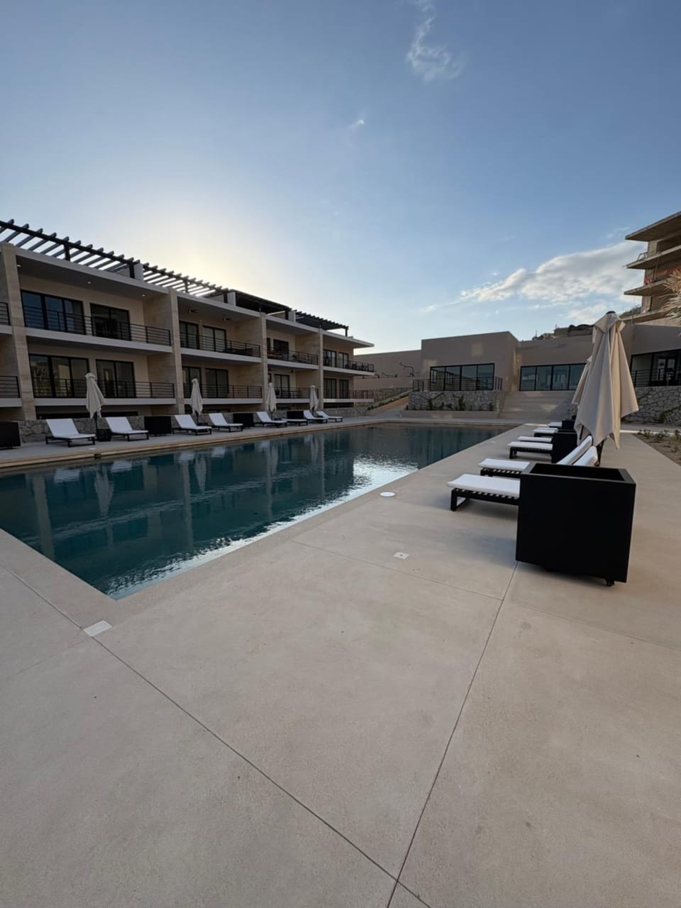 Property building, Natural landscape, Pool view, Swimming pool, sunbed
