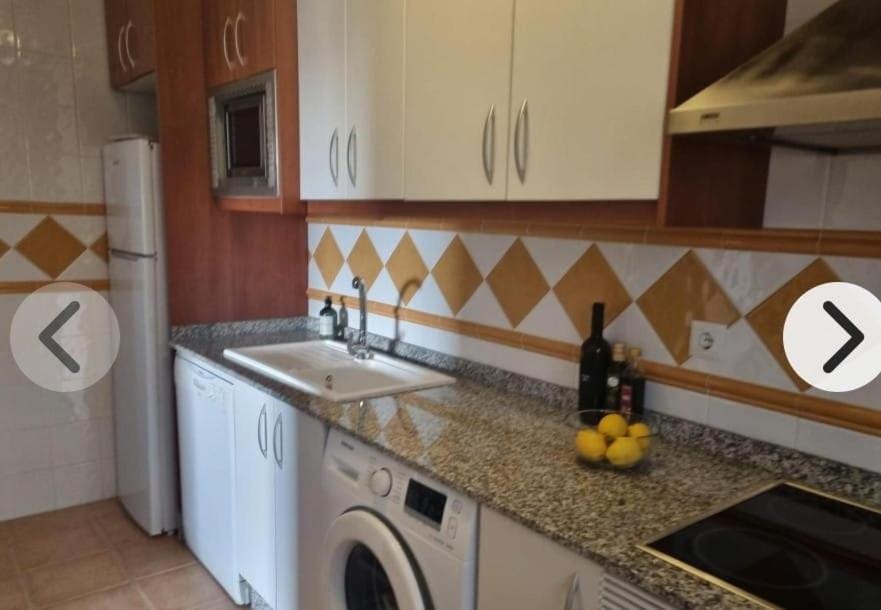 Kitchen or kitchenette, dishwasher, stove, washing machine