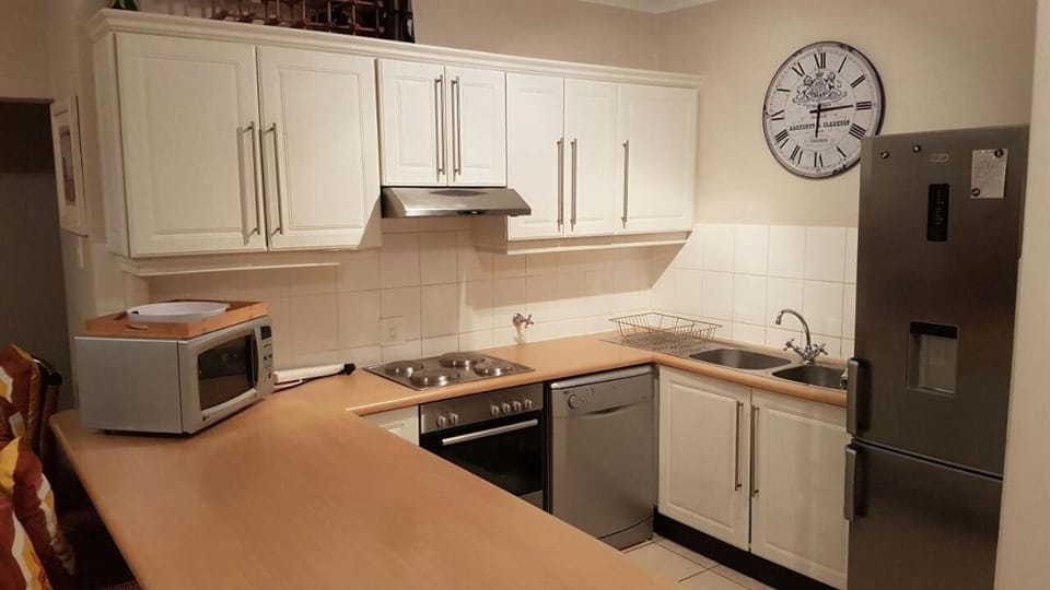 Kitchen or kitchenette, dishwasher, oven, stove, toaster
