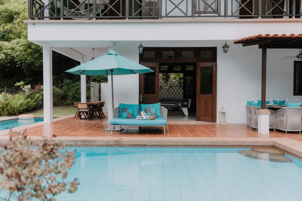 Property building, Patio, Seating area, Dining area, Swimming pool, sunbed