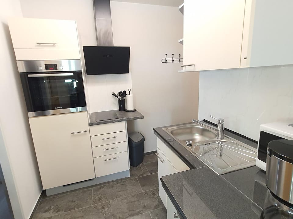 Kitchen or kitchenette, stove, towels, kitchen
