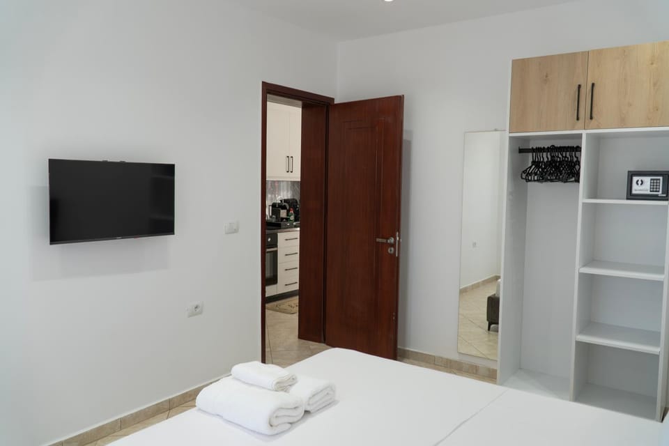 Bed, towels, wardrobe