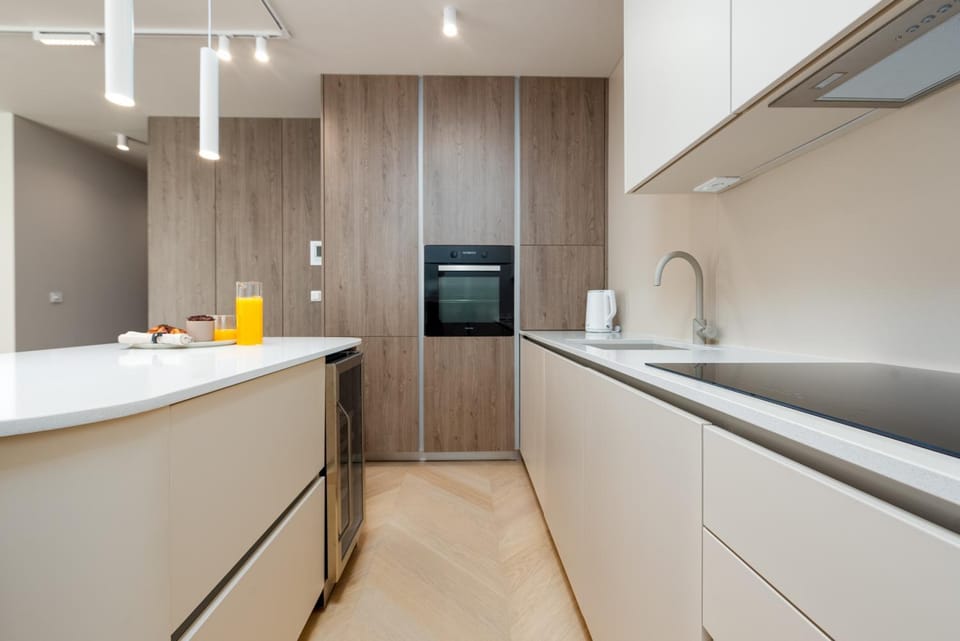 Kitchen or kitchenette, dishwasher, oven, stove