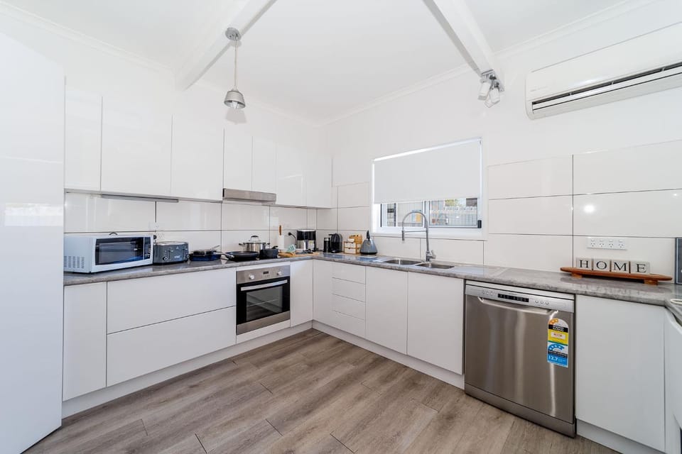 Kitchen or kitchenette, dishwasher, oven, stove, toaster