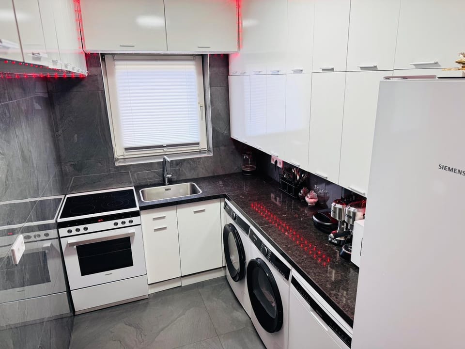 Kitchen or kitchenette, oven, stove, washing machine, dryer