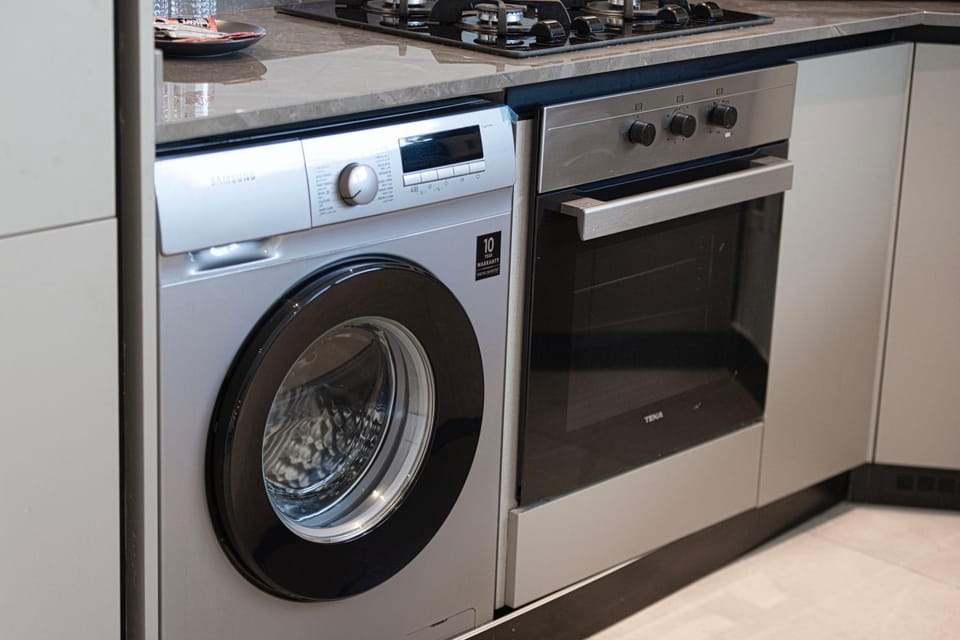 Kitchen or kitchenette, washing machine