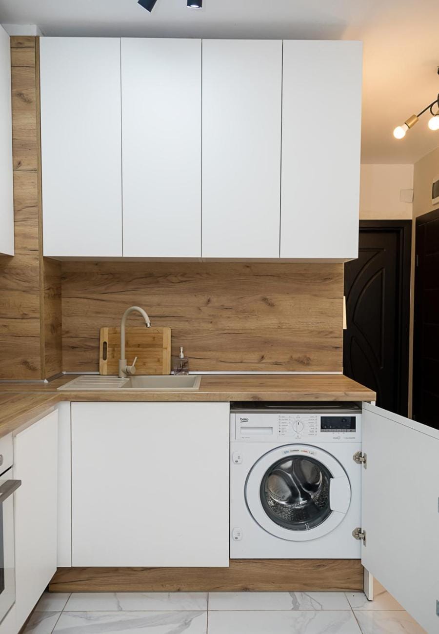 Kitchen or kitchenette, dishwasher, stove, washing machine