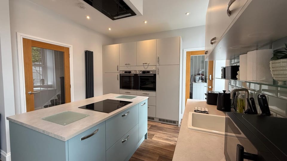 Kitchen or kitchenette, dishwasher, oven, stove