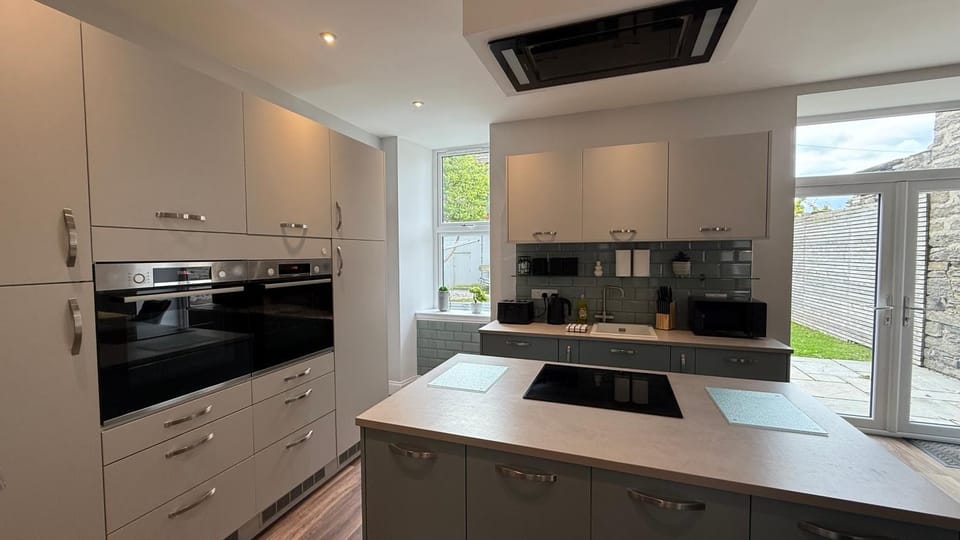 Kitchen or kitchenette, dishwasher, oven, stove, toaster