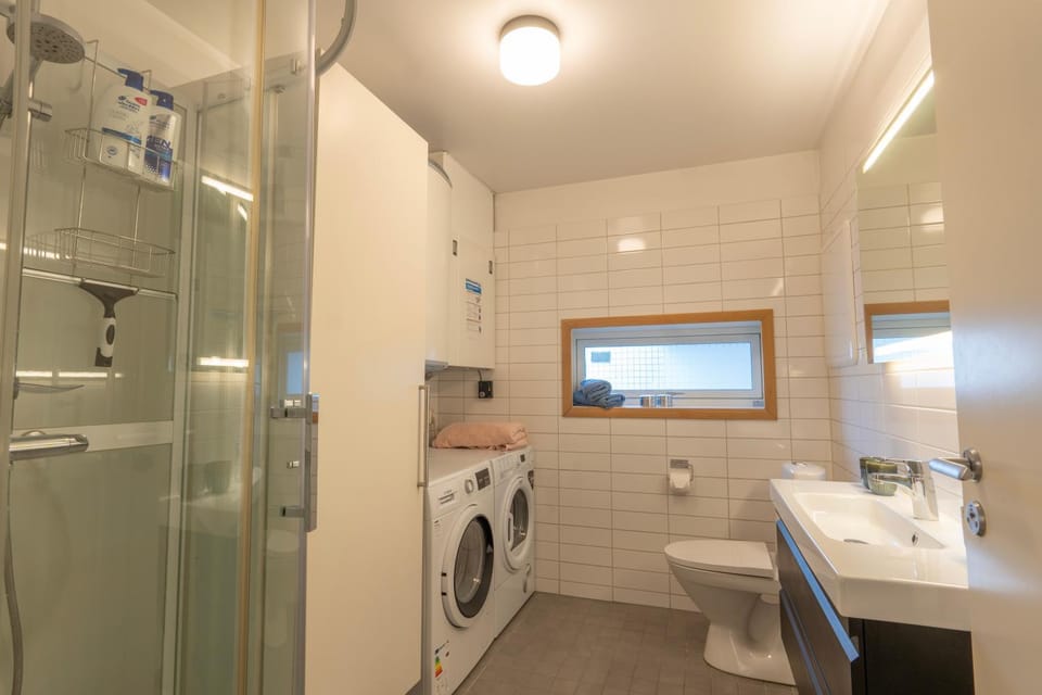 Shower, Toilet, Bathroom, towels, washing machine, dryer