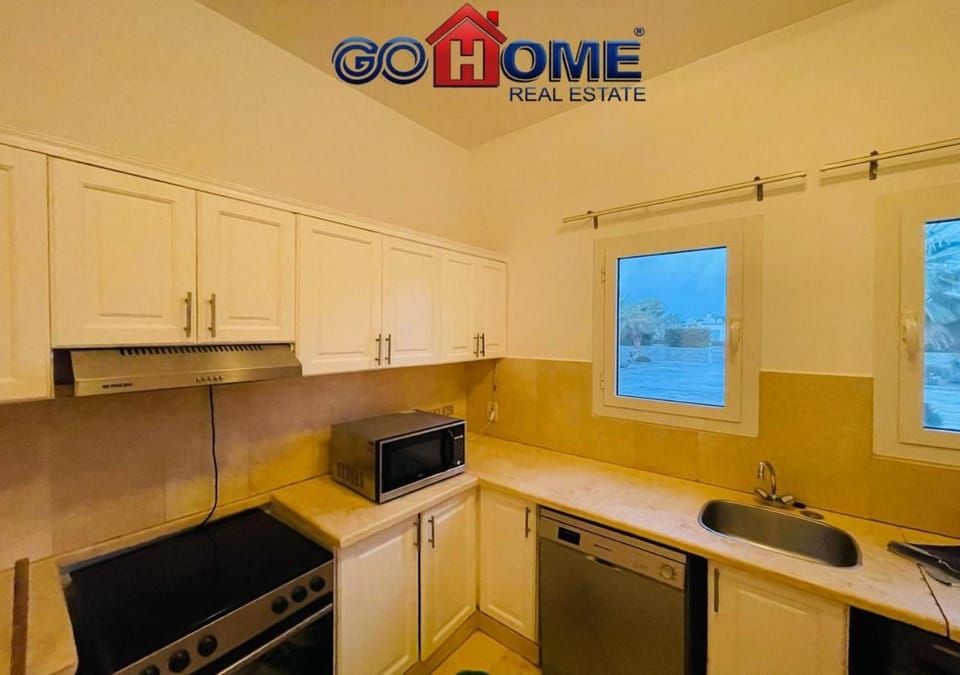 Kitchen or kitchenette, dishwasher, oven, stove