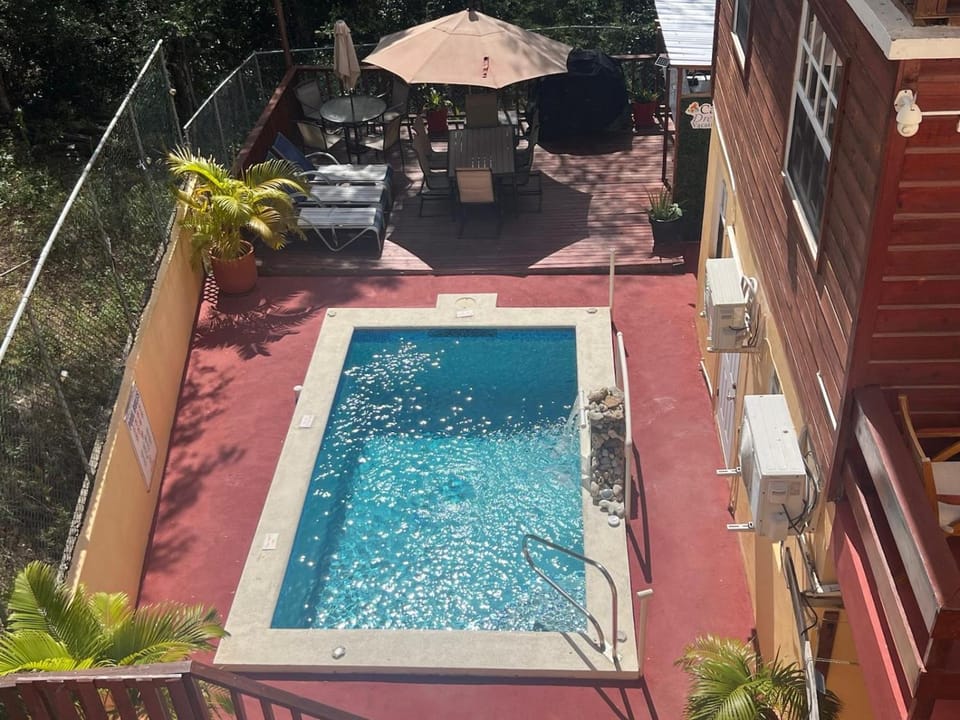 Property building, Patio, Pool view, Swimming pool, sunbed